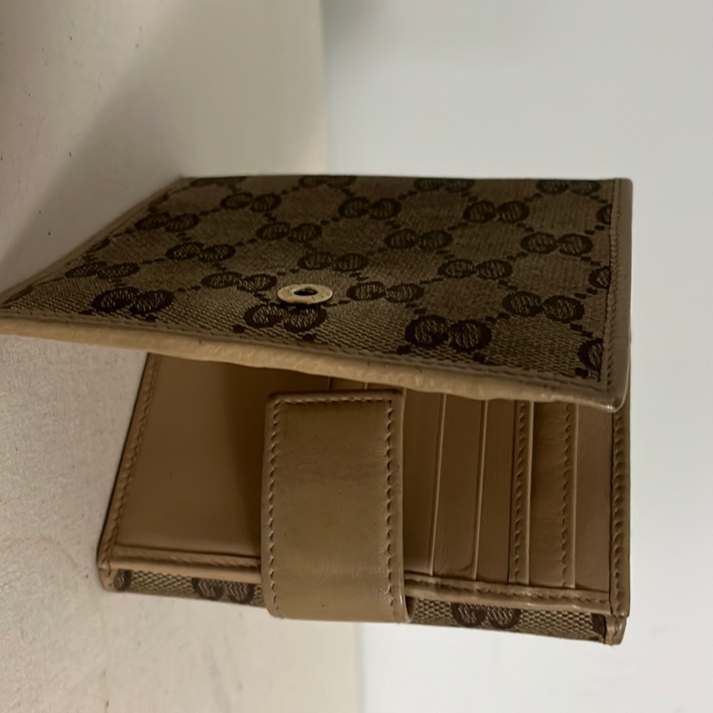 Gucci fold wallet for sale.